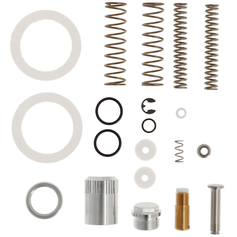 Mechanical parts including springs, washers, and metal components on a white background