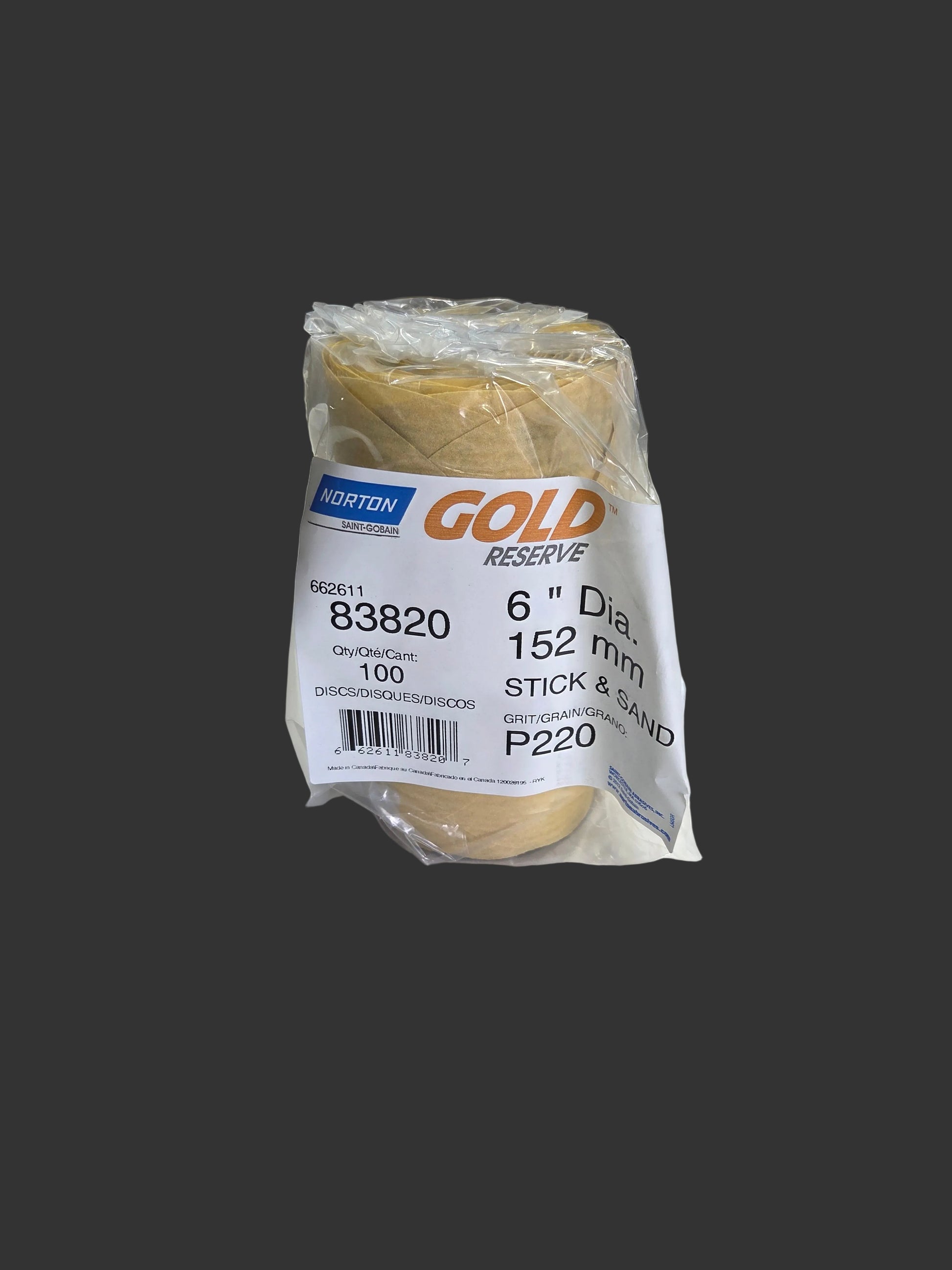 Packaged spool of thread with a label on a white surface in a warehouse setting