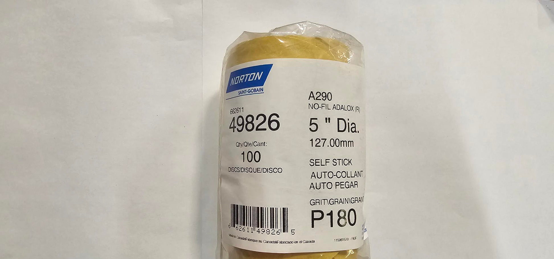 Roll of tape with a label on a white background