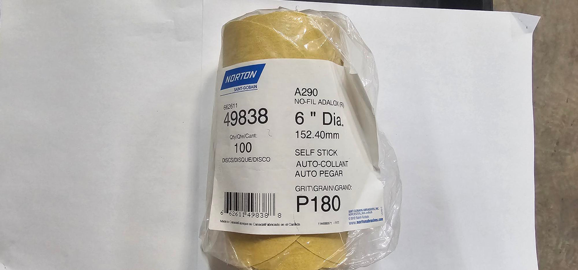 Packaged Norton sandpaper with a white background