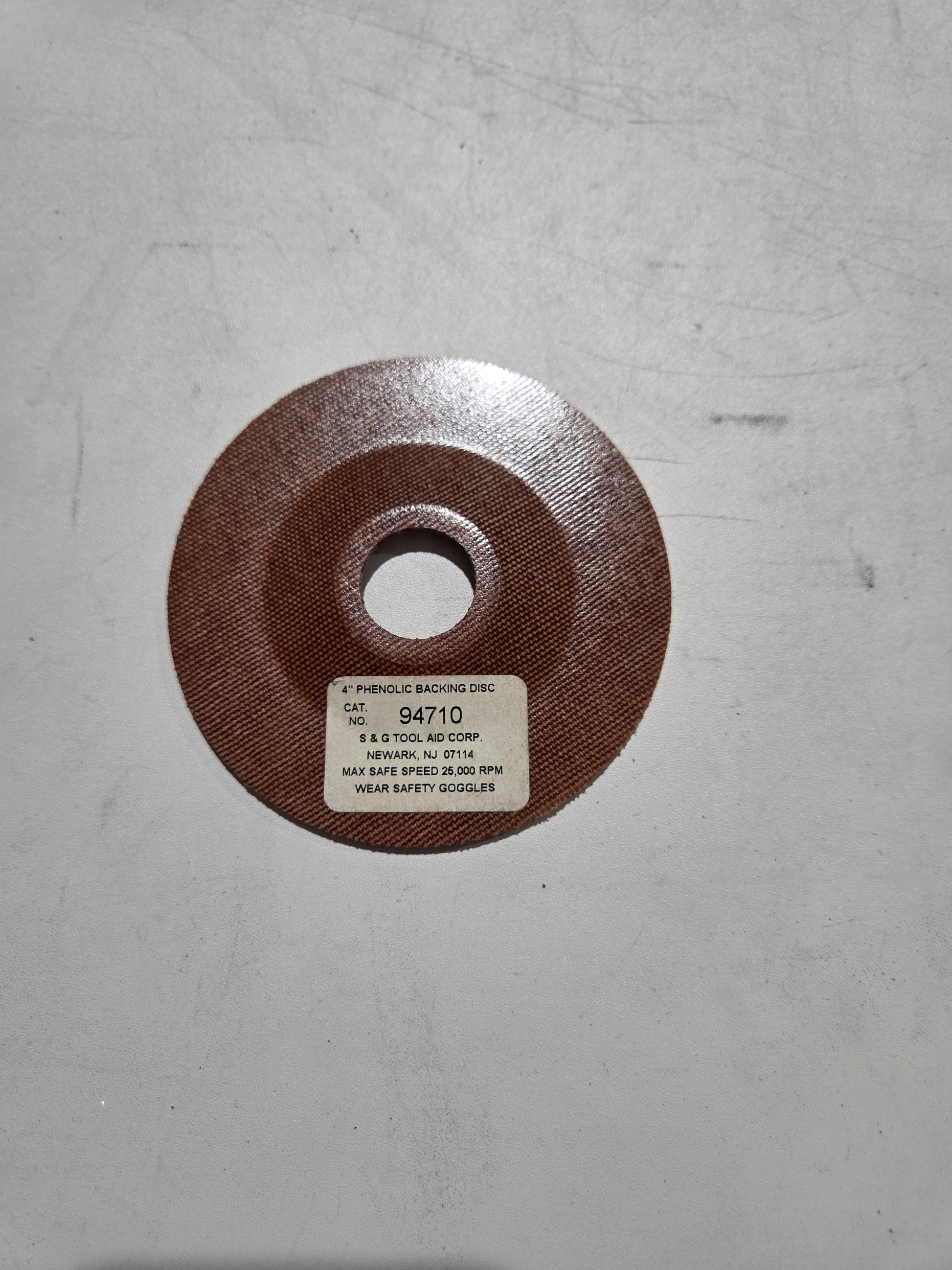 Disc brake rotor on a gray background
