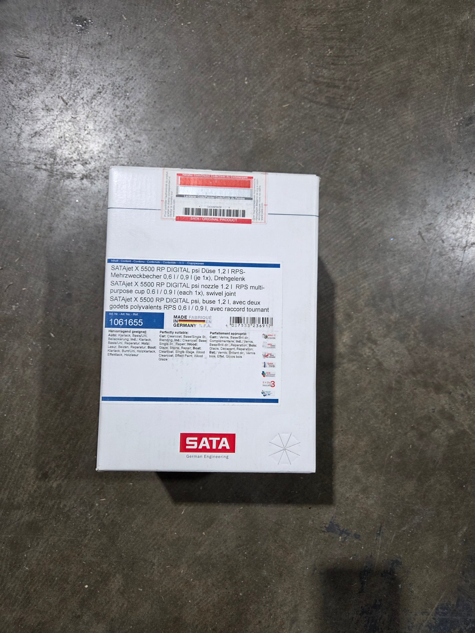 White box with text and a SATA label on a gray surface