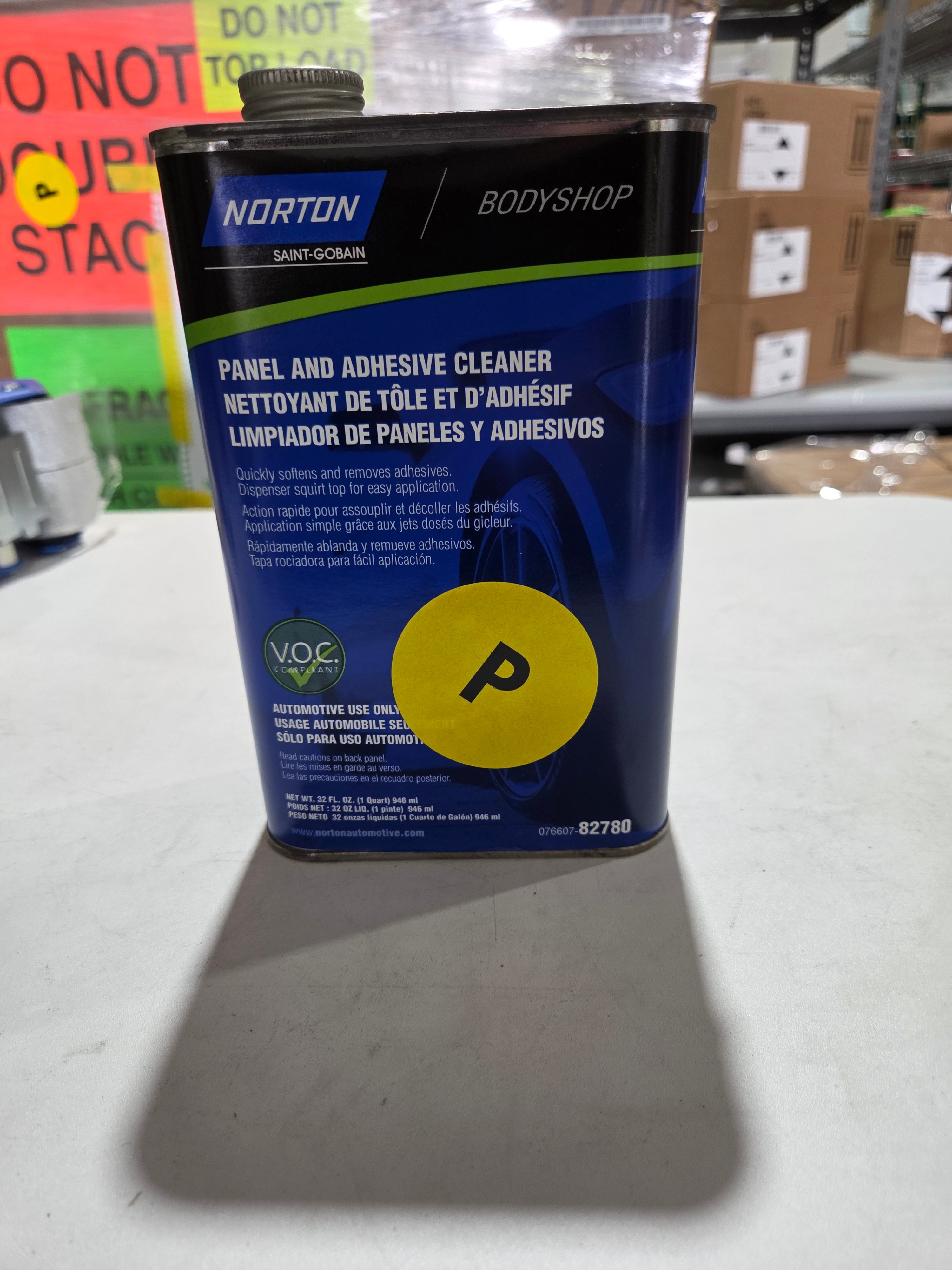 Norton panel and adhesive cleaner with a yellow 'P' label on a white surface.