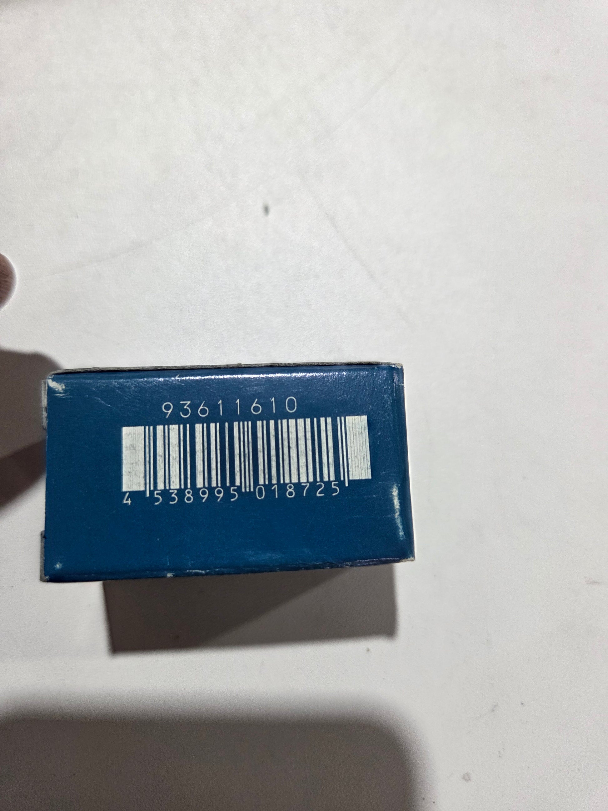 Blue rectangular box with a barcode on a white background