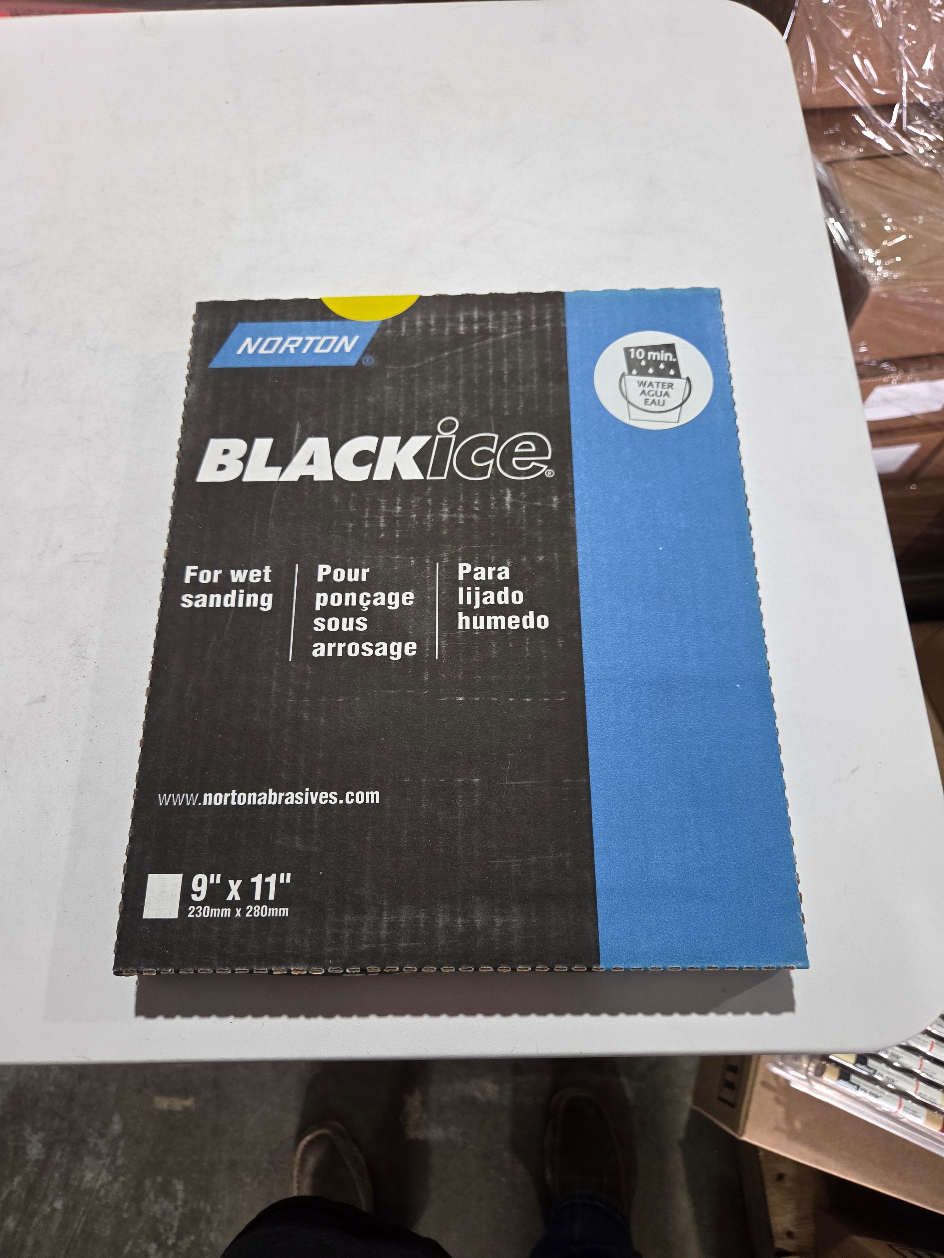 Black Ice packaging on a white surface with a blurred background