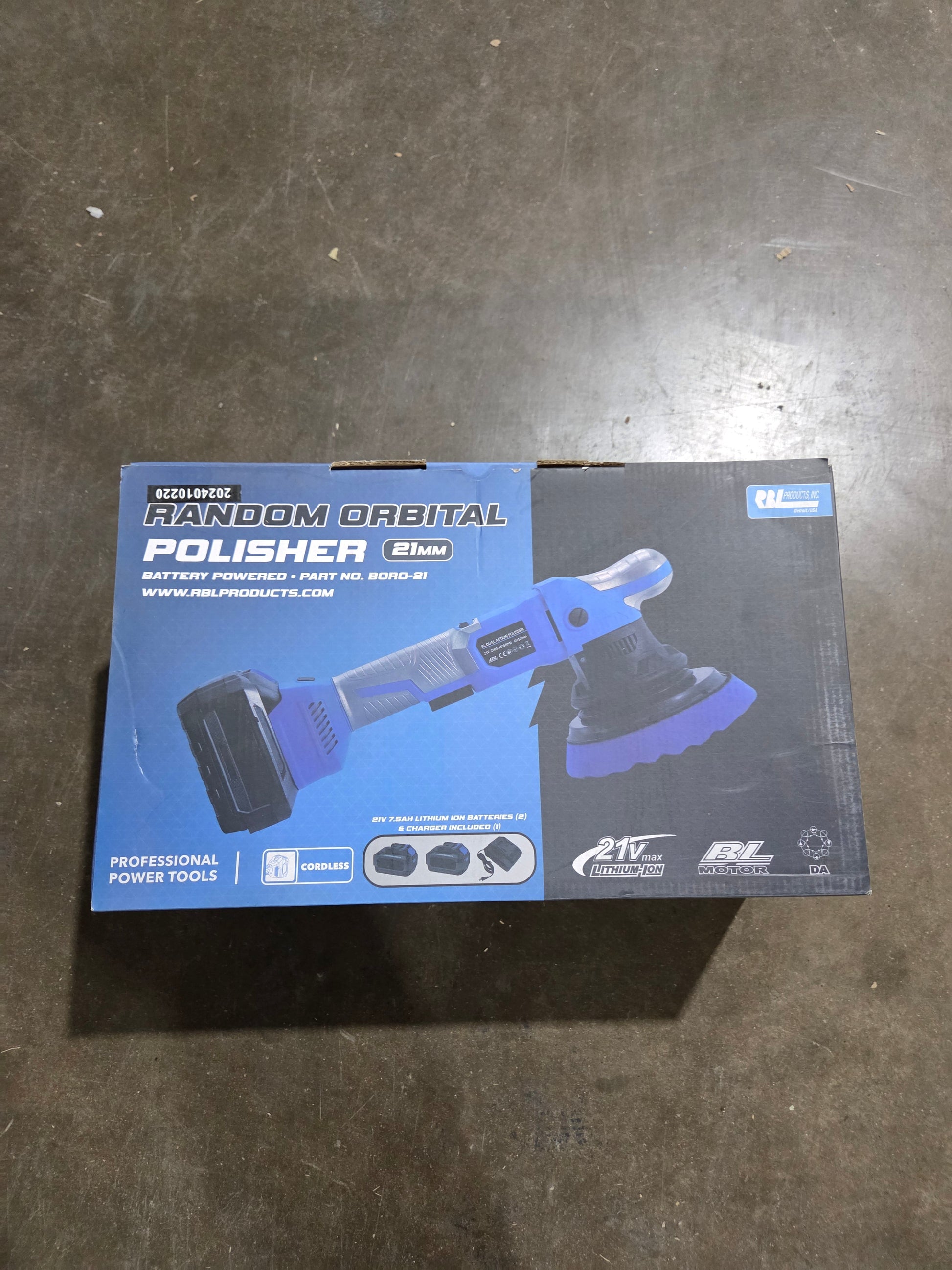 Box of a random orbital polisher on a dark surface