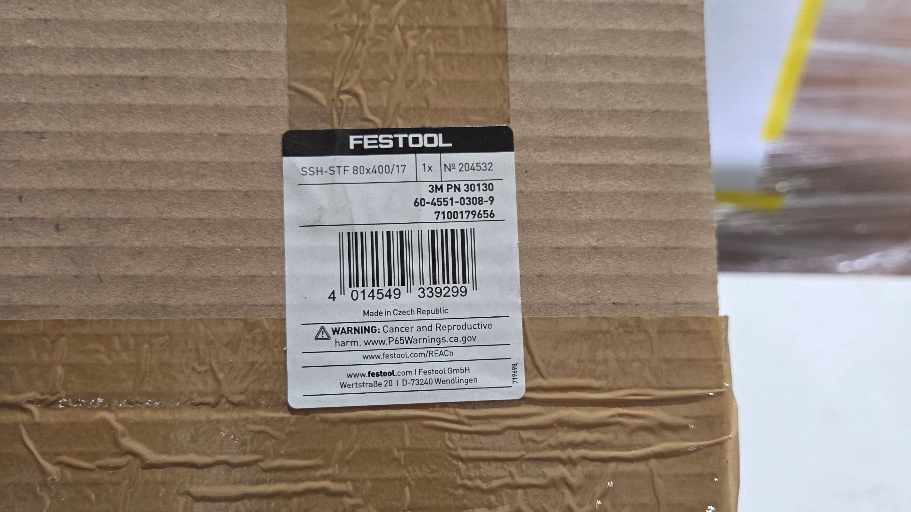 Festool label on a cardboard box with a blurred background