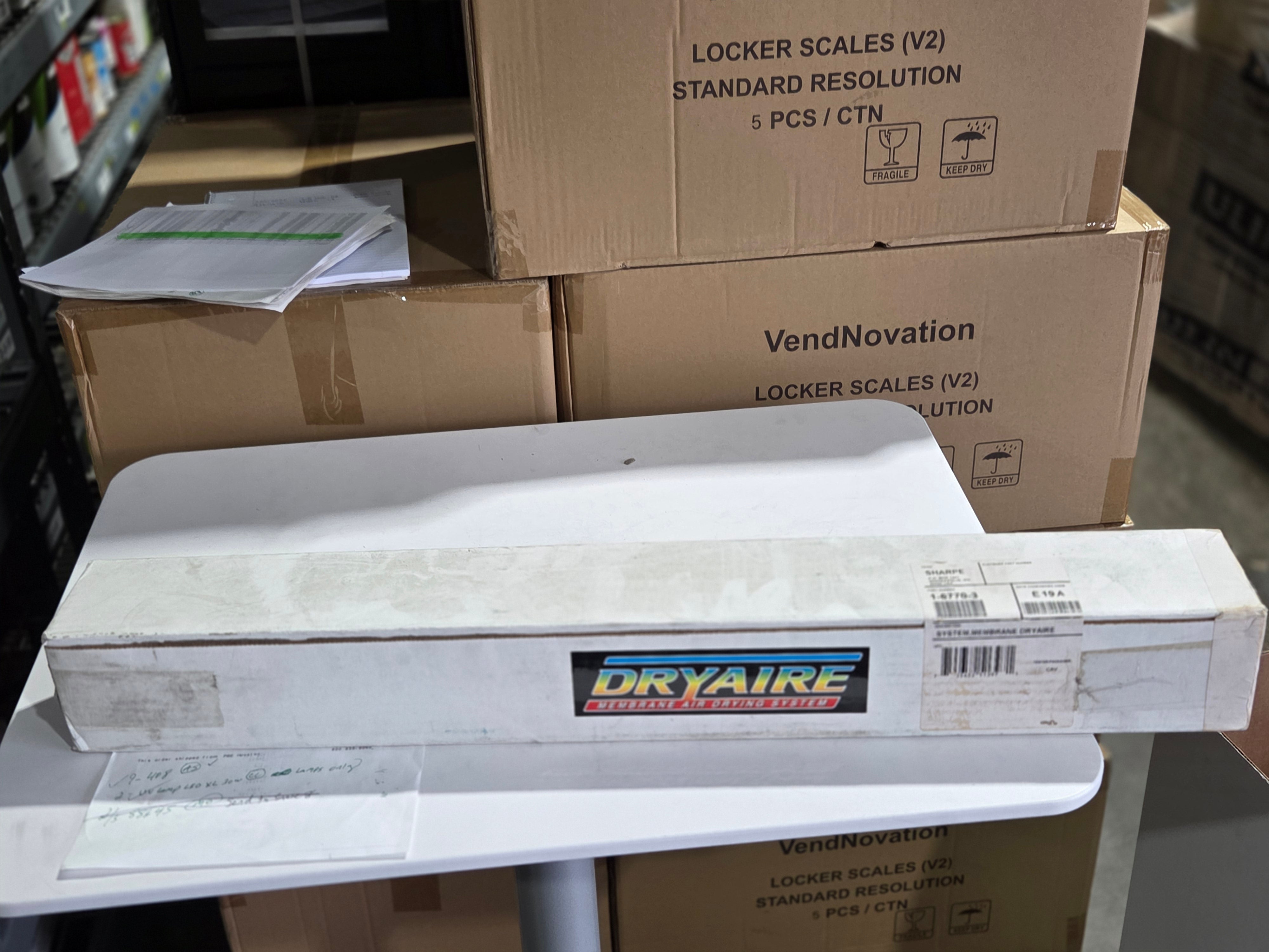 DryAIRE product on a table with cardboard boxes in the background