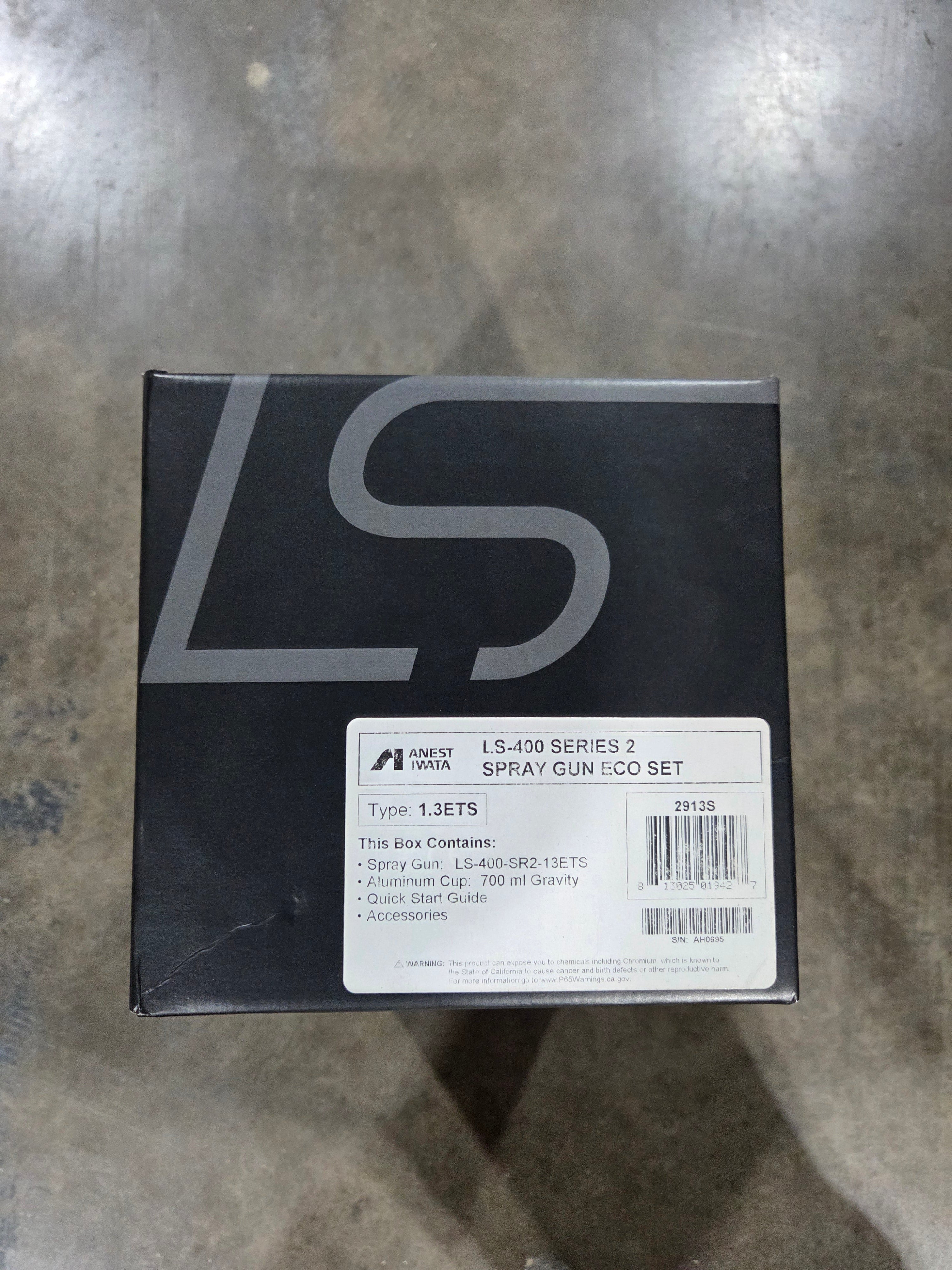Black box with 'LG' branding on a metallic surface