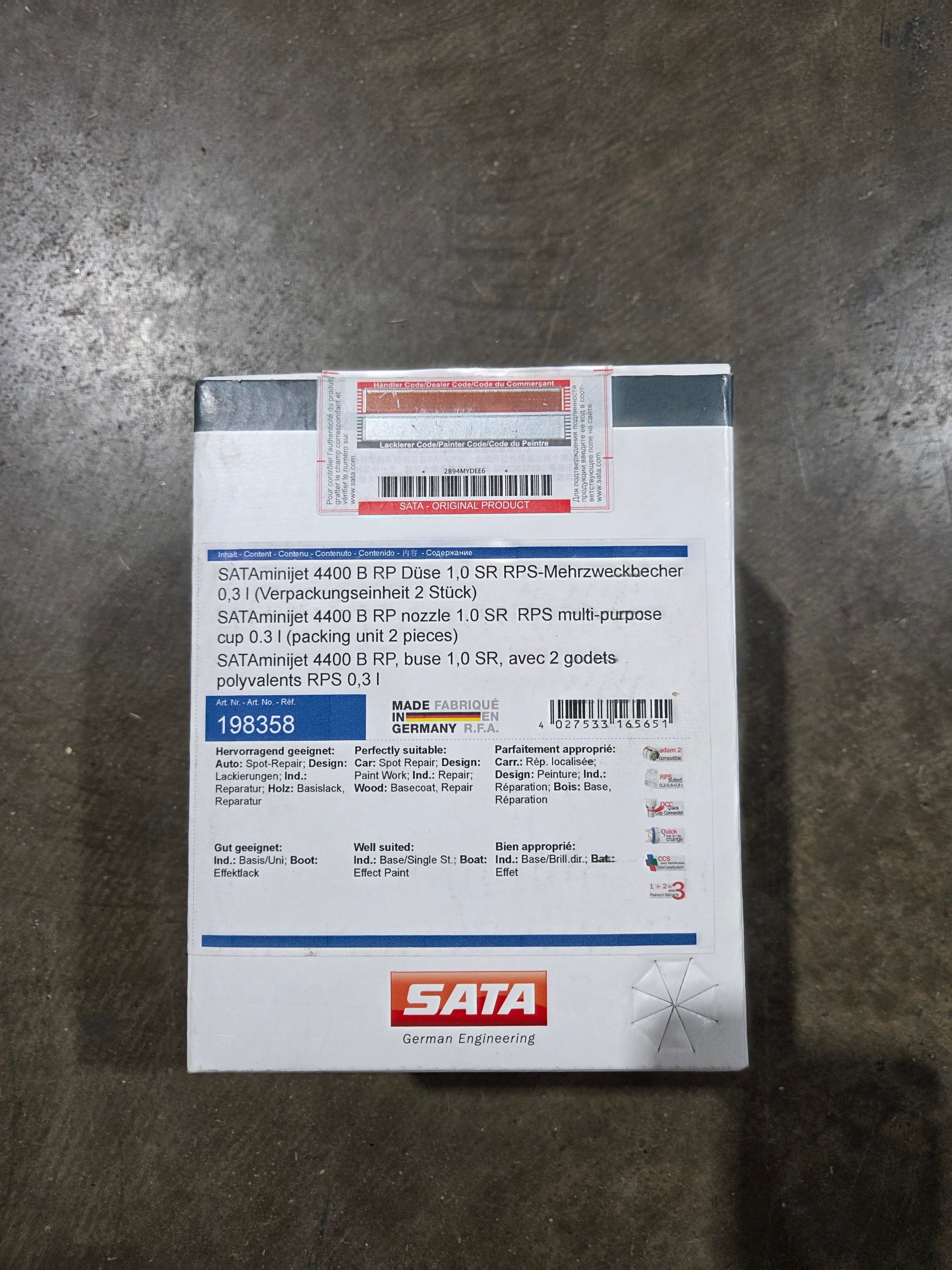 SATA disk packaging on a gray surface