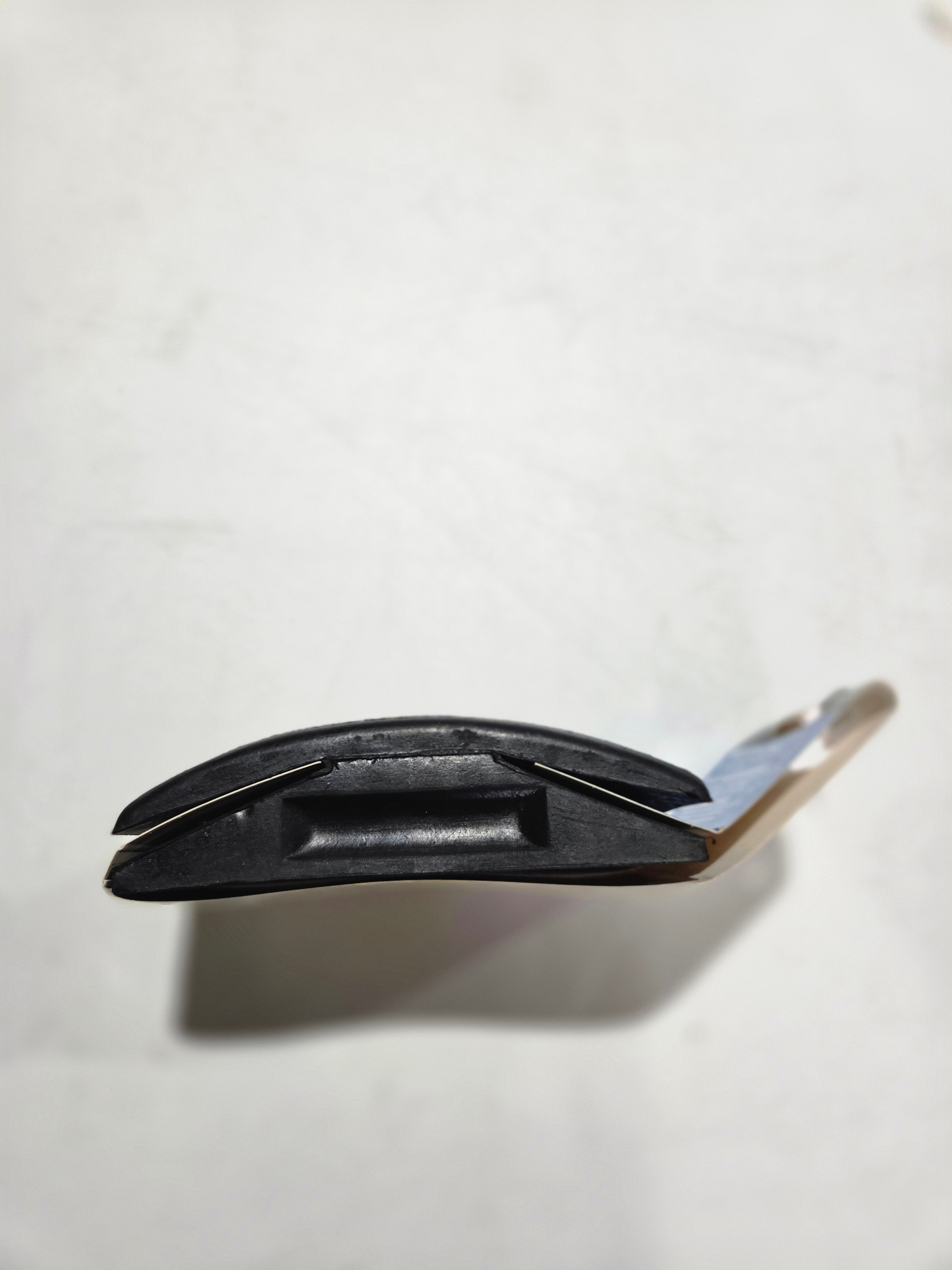 Black knife with a silver blade on a white background