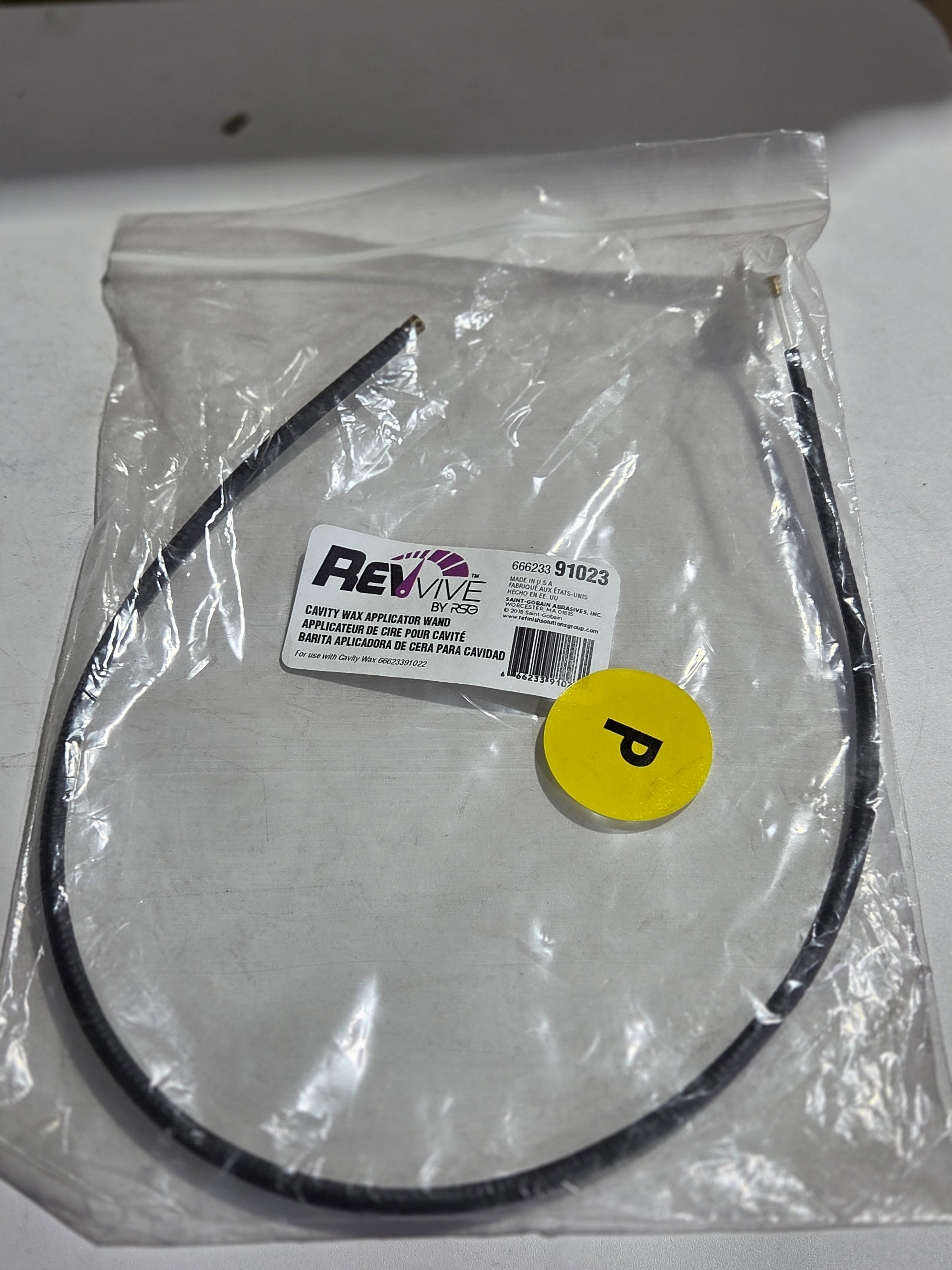 Round metal component with a yellow label and Flexa branding on a white background
