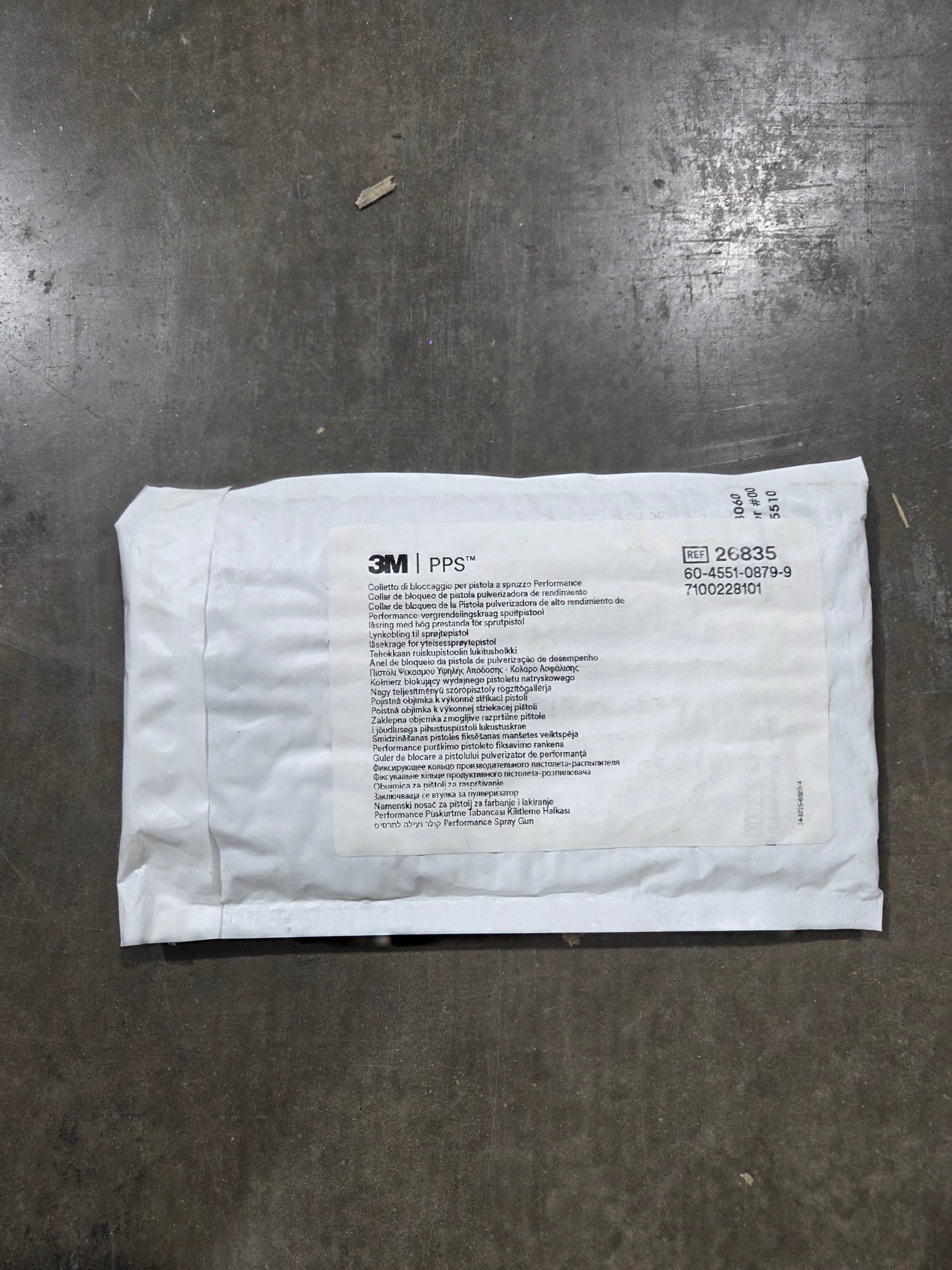 White envelope with text on a gray surface