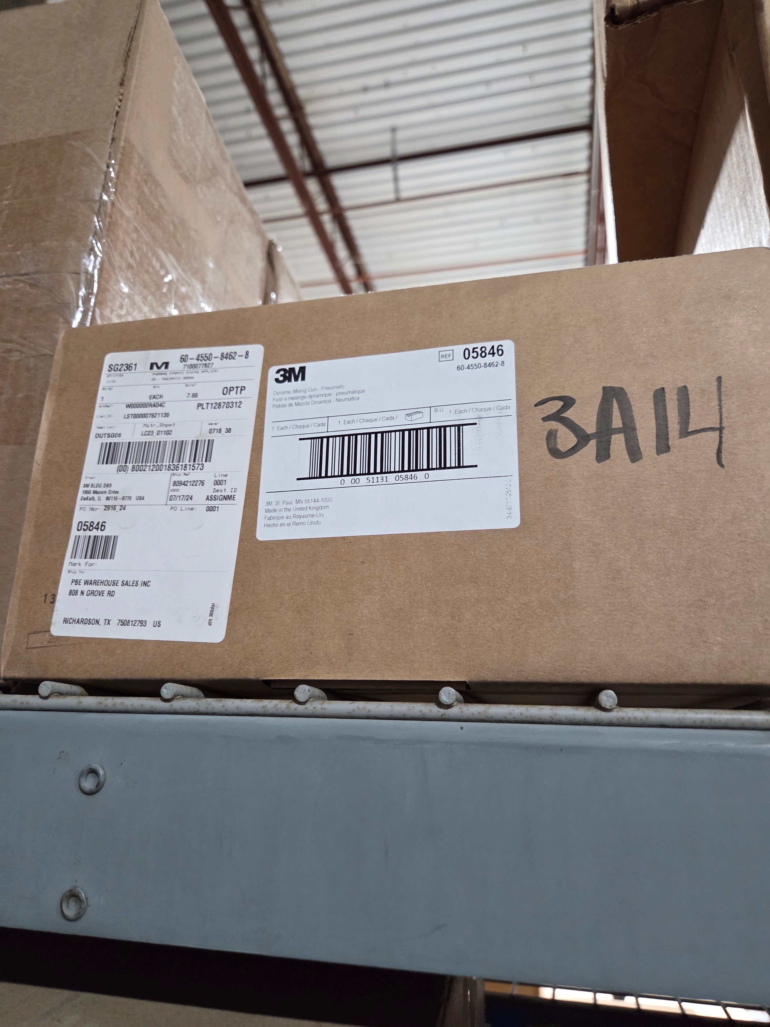 Cardboard boxes with shipping labels on a metal surface